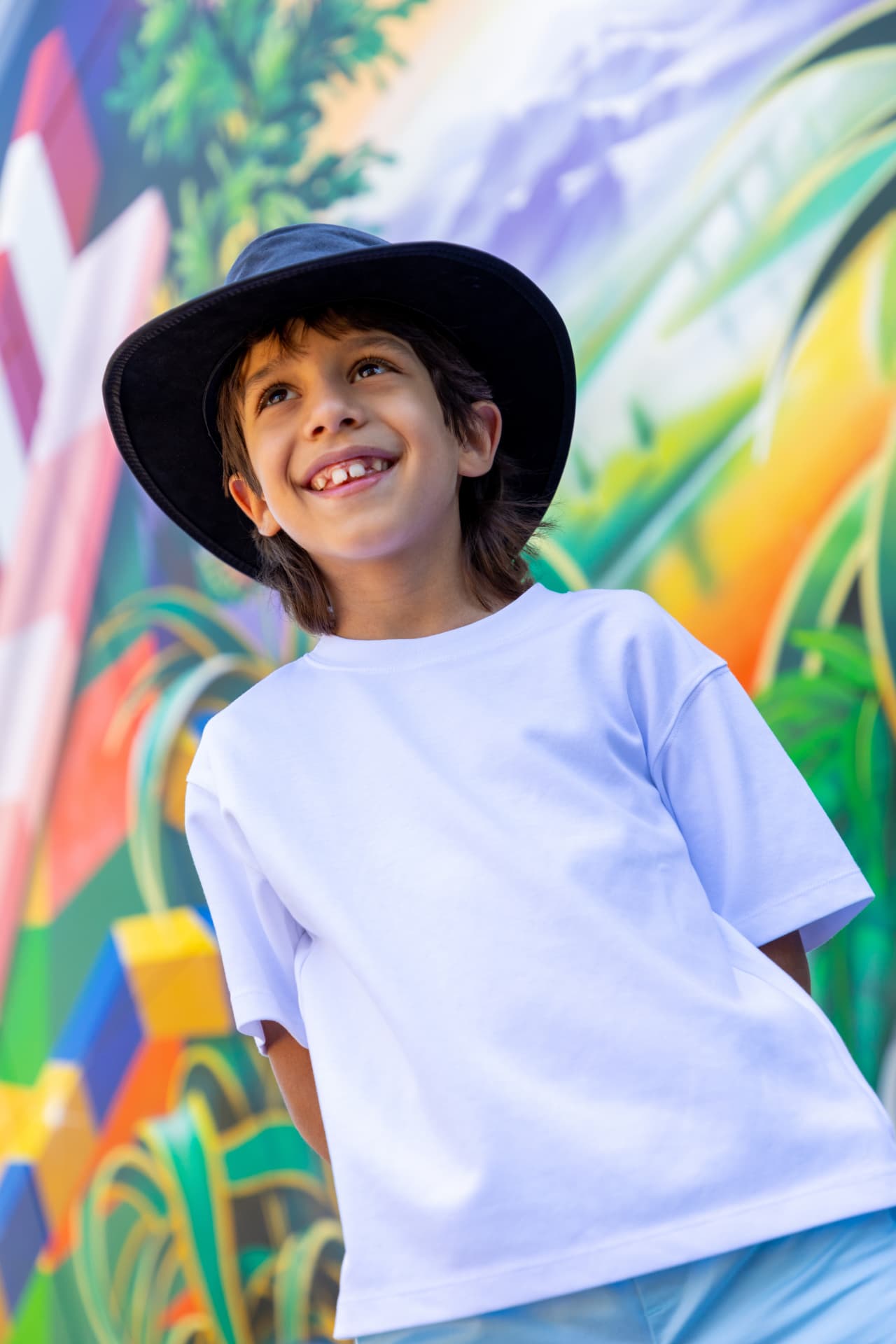 Smiling young child photographed by POP! Photography